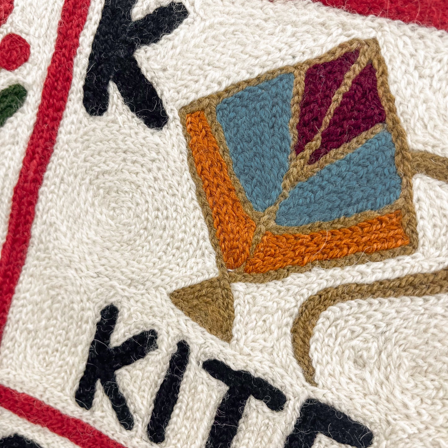 Alphabet pattern hand embroidered rug