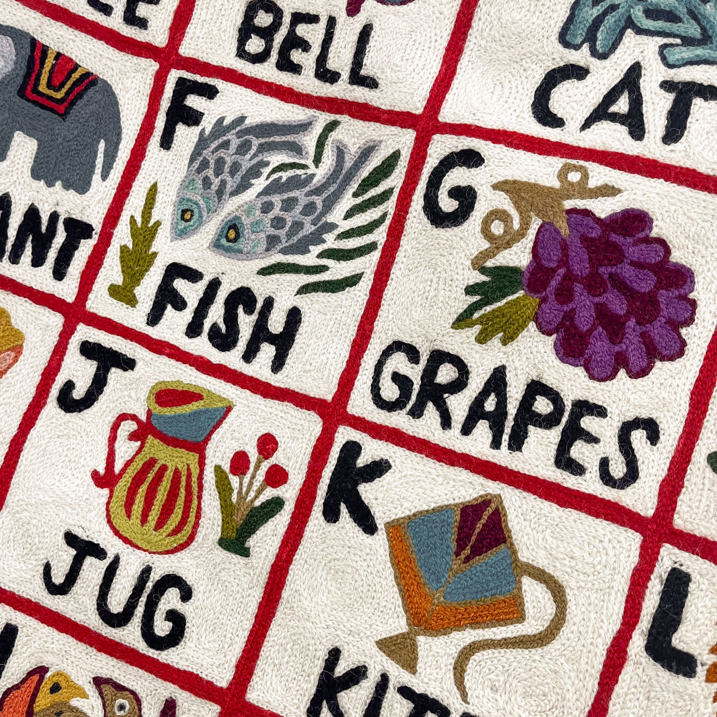 Alphabet pattern hand embroidered rug