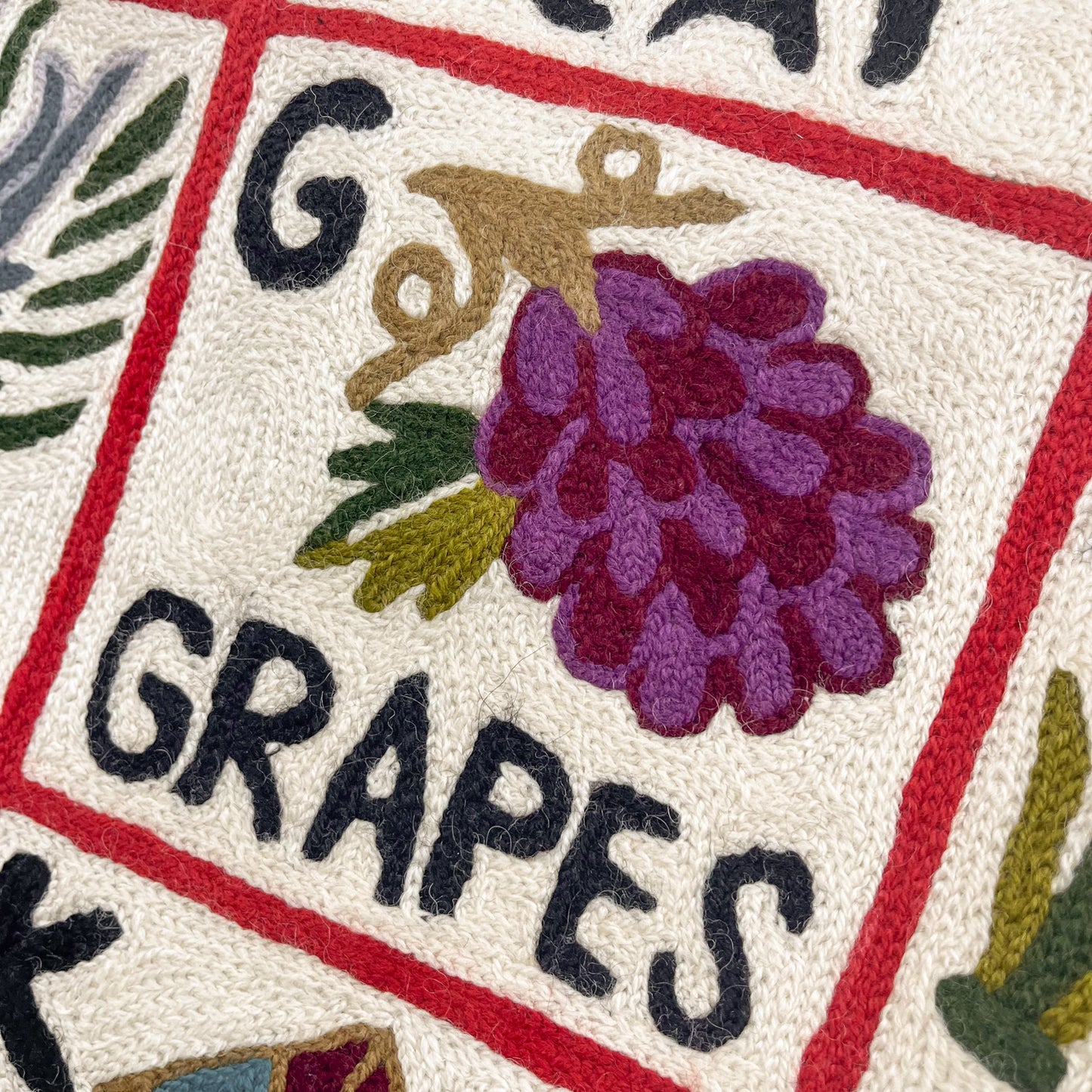 Alphabet pattern hand embroidered rug